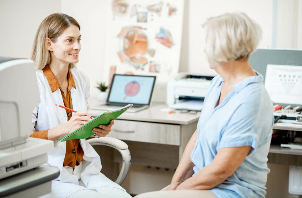 An older woman speaks to her smiling optometrist about solutions for dry eyes