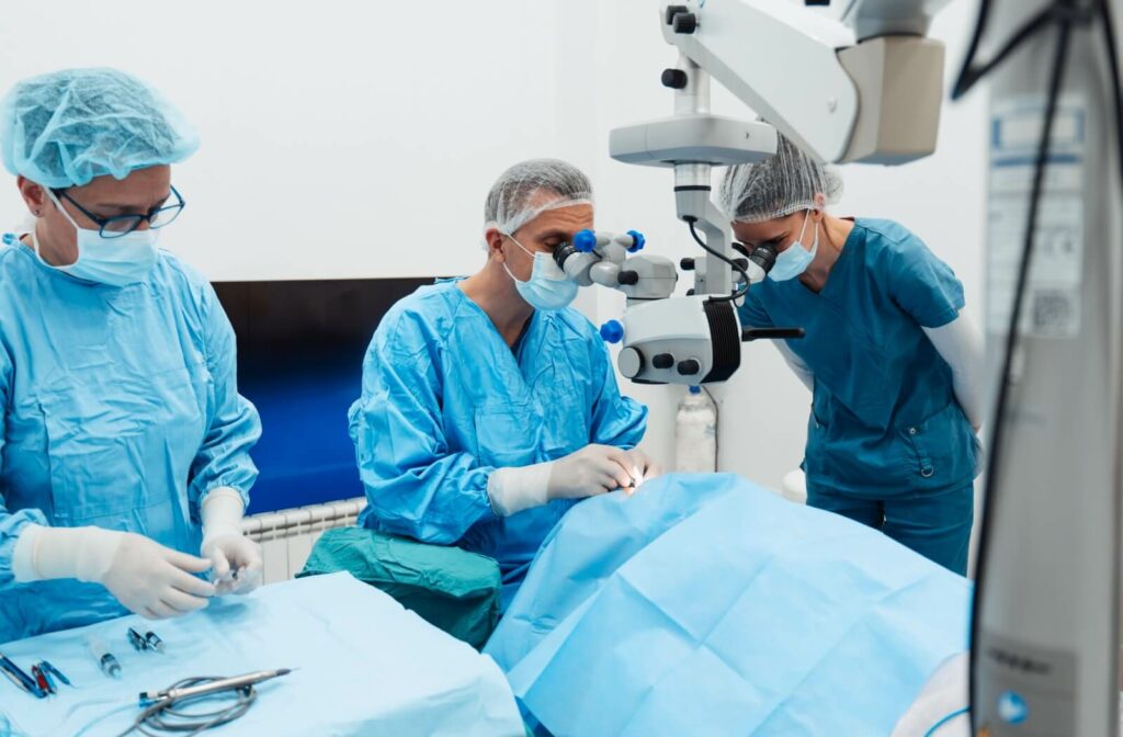 Surgeons performing cataract surgery in an operating room.